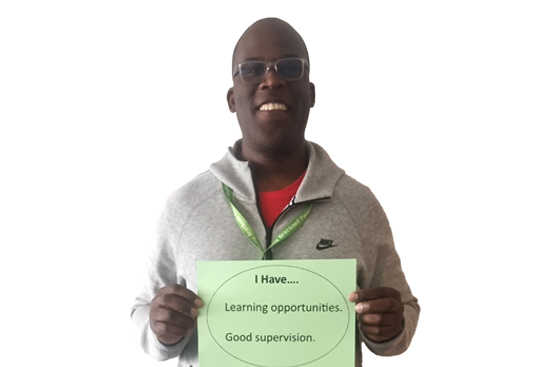 Social worker holding up sign: I have learning opportunities. Good supervision.