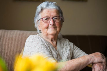 Older lady sitting on the sofa