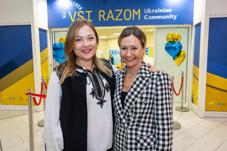 Two ladies standing in front of the Vsi Razom Community Hub