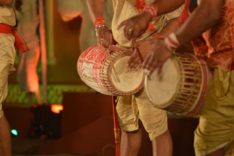 People playing the drums in cultural dress