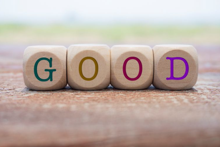four wooden blocks with letters spelling out the word 'good'