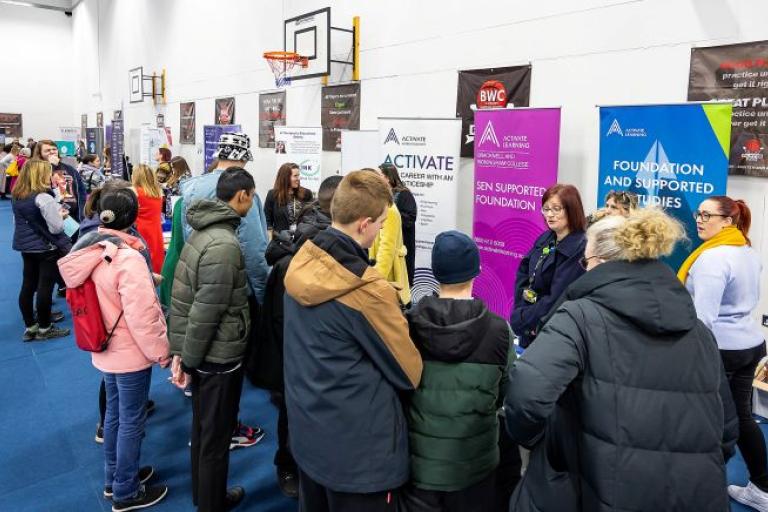 a group of young people at an exhibition