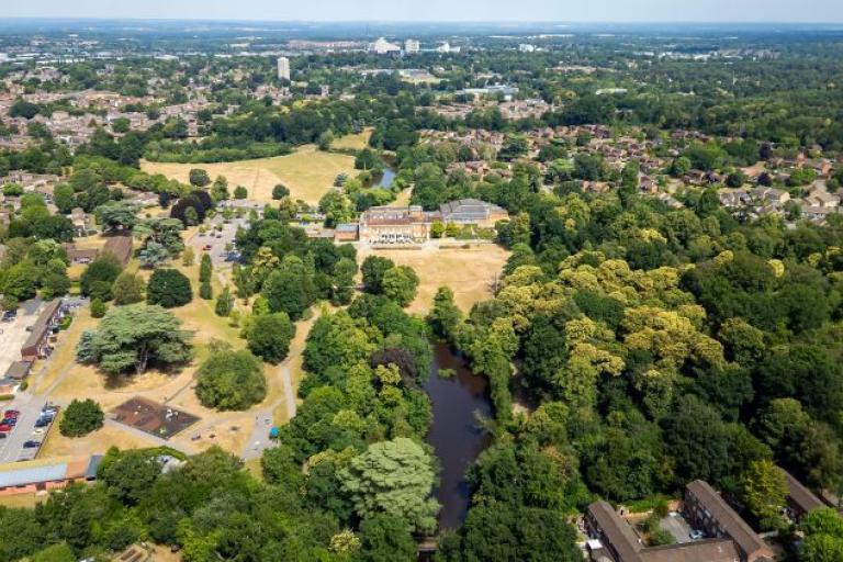 an aerial shot of parkland and urban area