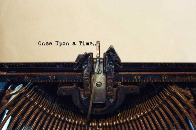 Antique type writer with a page that has the words: "Once Upon a Time..."