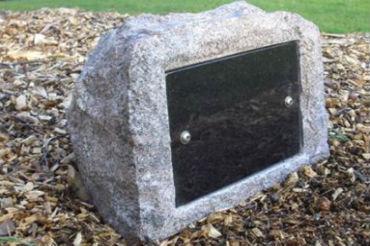 Copse stone memorial with plaque.