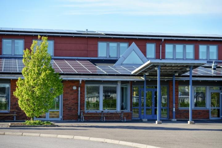 Solar panels on top of a school roof