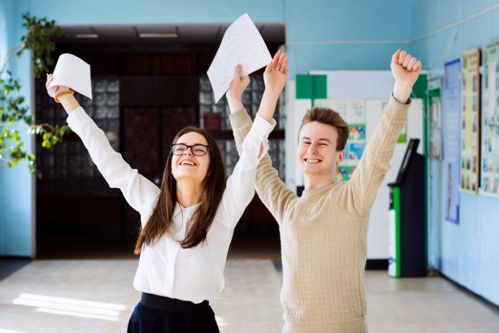 two students celebrating exam results