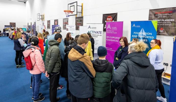 a group of young people at an exhibition