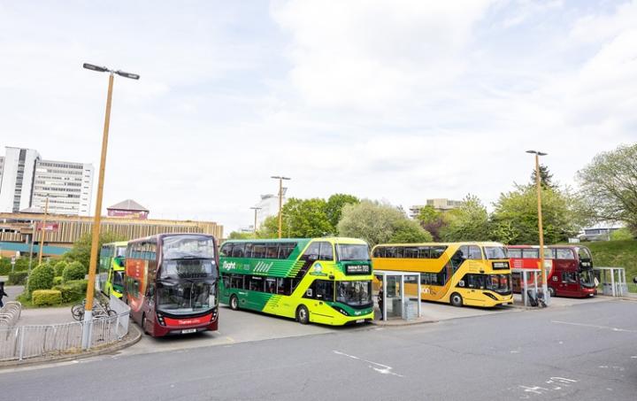 Four buses in parking spaces at Bracknell bus station