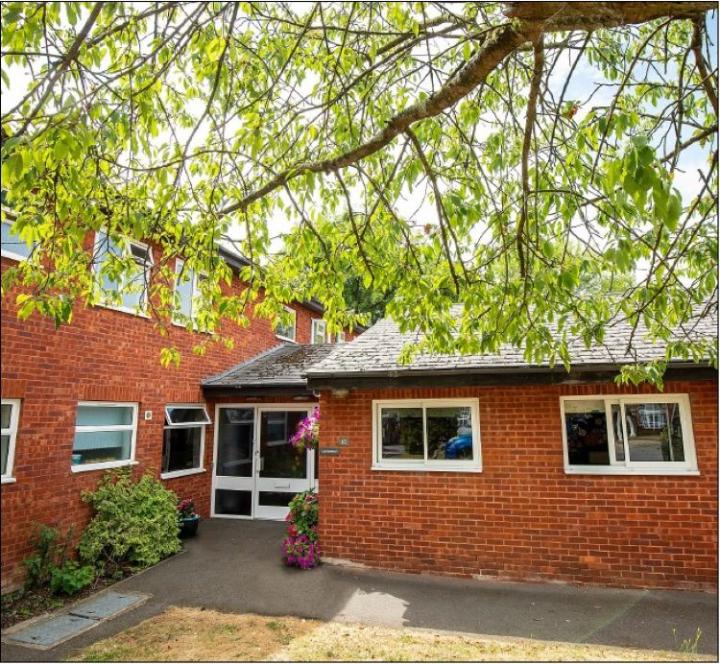 a brick building near a tree