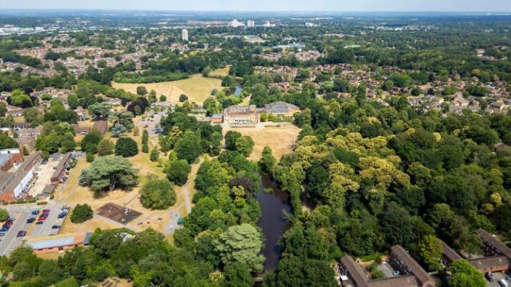 an aerial shot of parkland and urban area