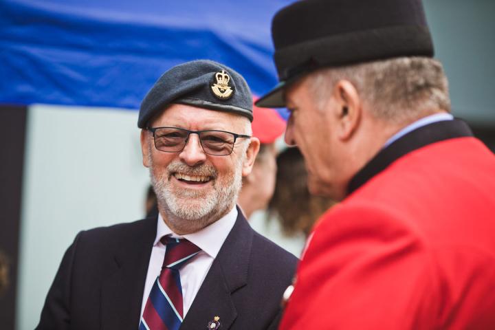 Two veterans talking and smiling