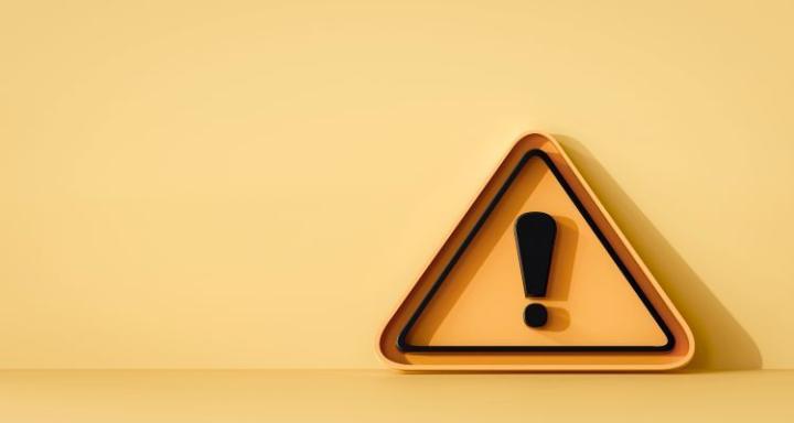 an orange warning triangle with black exclamation mark