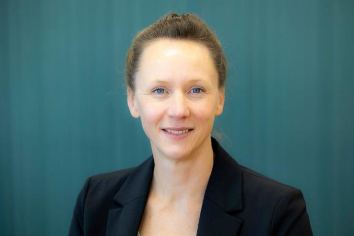 Head and shoulders photo of a woman smiling 