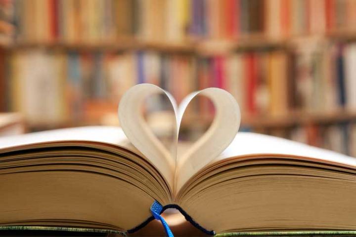 Open book with pages in the centre forming a heart shape