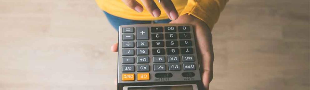 person holding a calculator