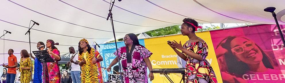singers on stage in colourful dress