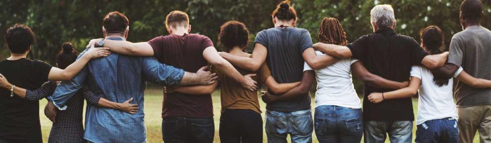 Group of people cross armed in a park