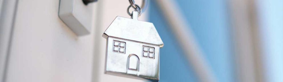key in a lock with a silver home key ring