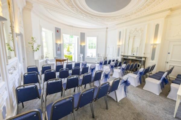 The back, lefthand view of the Haversham Room, showing rows of chairs.