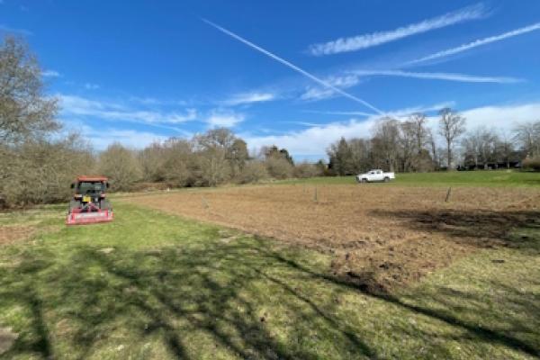 A tractor tilling the soil at Pope's Meadow.