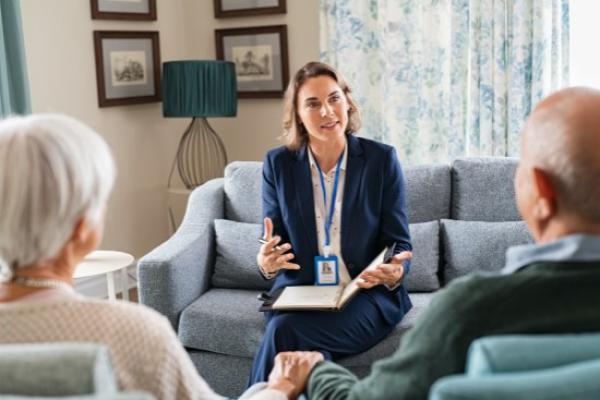 Health professional giving help and support to a couple