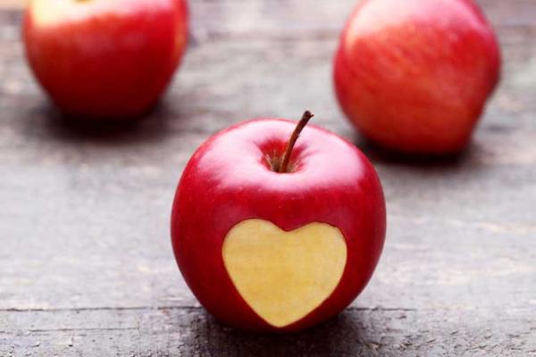 red apple with heart imprint