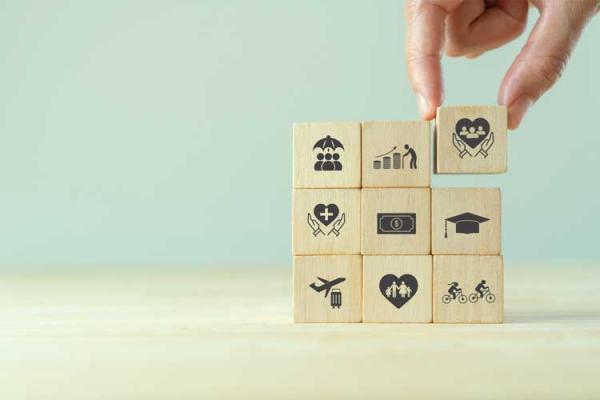 9 wooden blocks printed with staff benefit icons