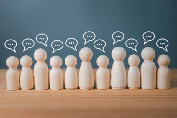 wooden peg people with speech bubbles