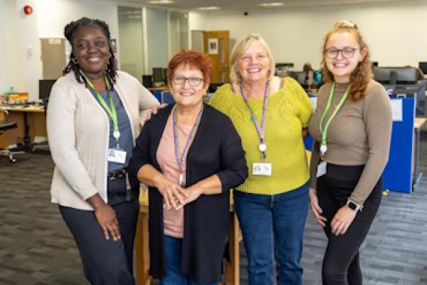 The Breakthrough team stand smiling as they pose for camera.