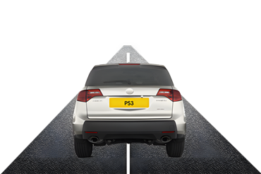 Back view of a white car with a yellow license plate on a straight road.