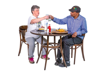 Two people at a table enjoying a meal together